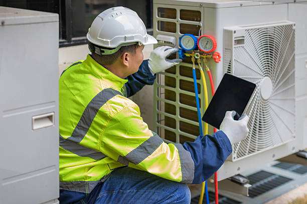 Professional Air Conditioning Repair technician working in Harvey, MI